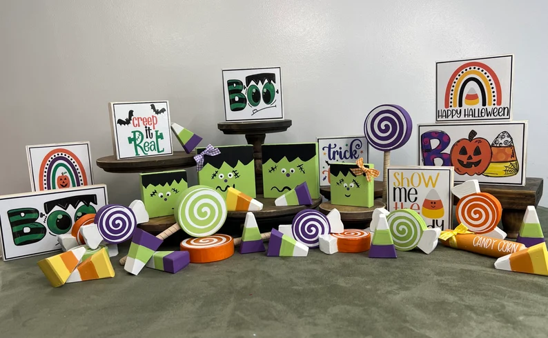 A picture showing off TONS of halloween shelf sitter ideas, including a block Frankenstein and different candies.