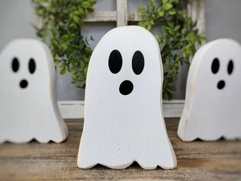 A picture showing off these cute wooden ghost shelf sitters.