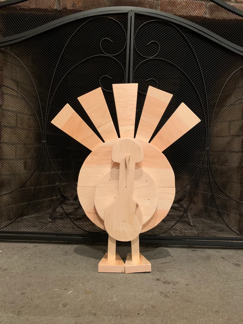 An adorable homemade thanksgiving wood crafts turkey.
