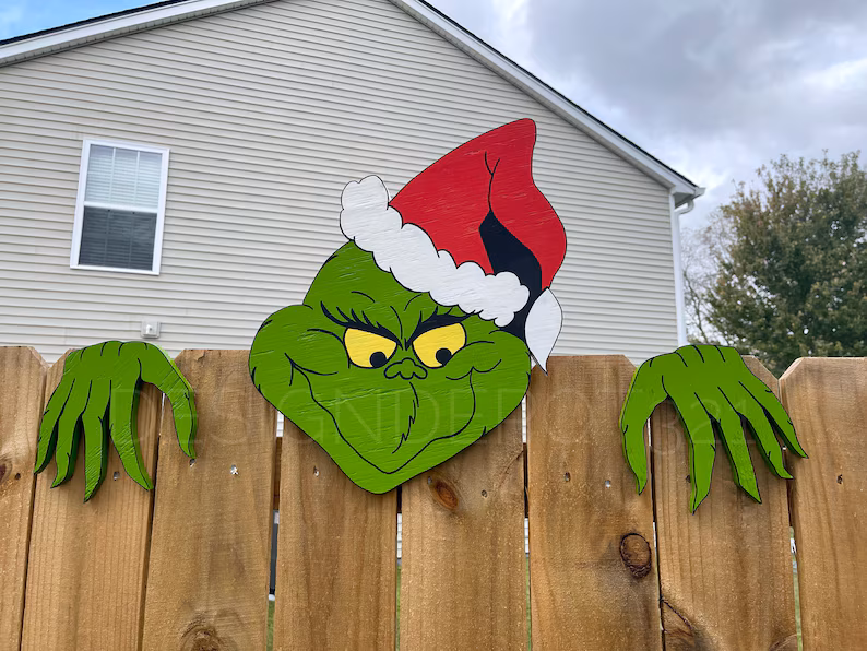 A pattern for a yard decoration of the Grinch peeking over your fence.