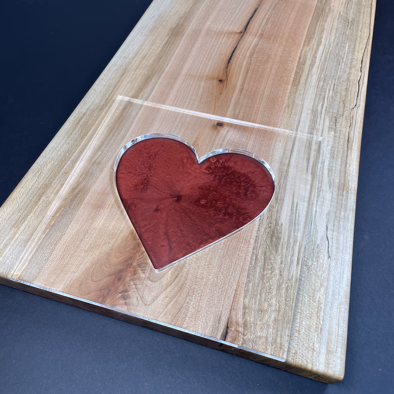 An acrylic heart router template.