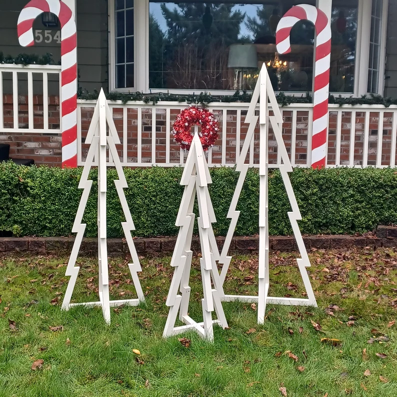 A picture of the rustic wood Christmas trees you can make for your yard.