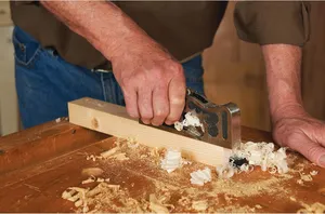 A picture of someone using the shoulder plane.