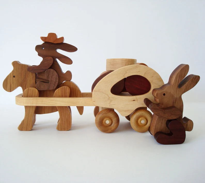 Some toy bunnies you can learn to make, riding a horse with a carriage attached.