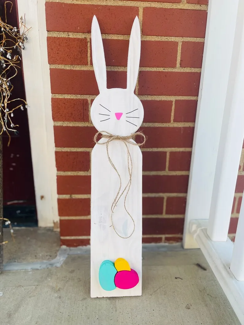A big cutout easter or spring decoration of a bunny that is perfect for a porch.