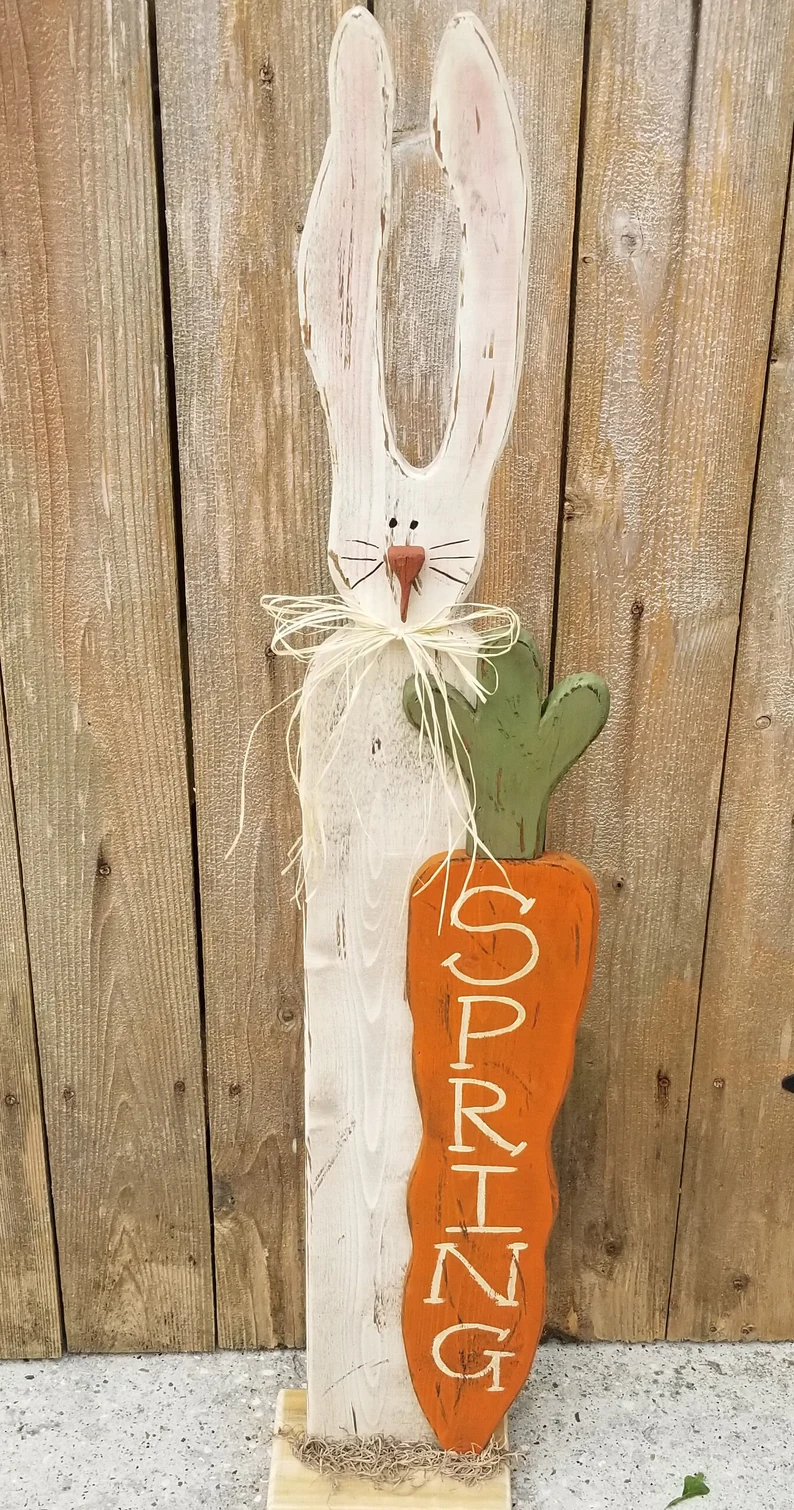 A bunny with a carrot that you can make and use to decorate your porch.