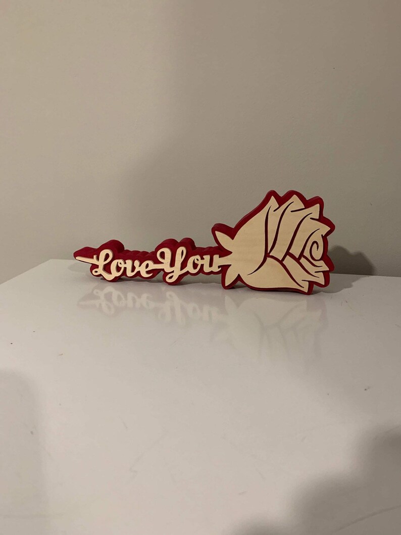 A rose with a stem that says "love you" that you can make with a scroll saw.